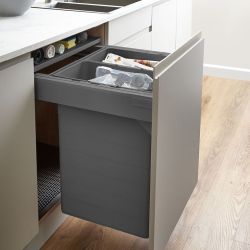 Blum Tandembox 600mm integrated pull-out kitchen bin with 2 compartments shown installed in white cabinet  displaying soft-close mechanism and grey interior storage