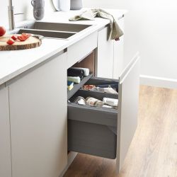 Blum Tandembox Ninka 600mm under-sink kitchen bin with 2 compartments  soft-close pull-out drawers  storing waste and recyclables  installed in white cabinet with granite countertop.